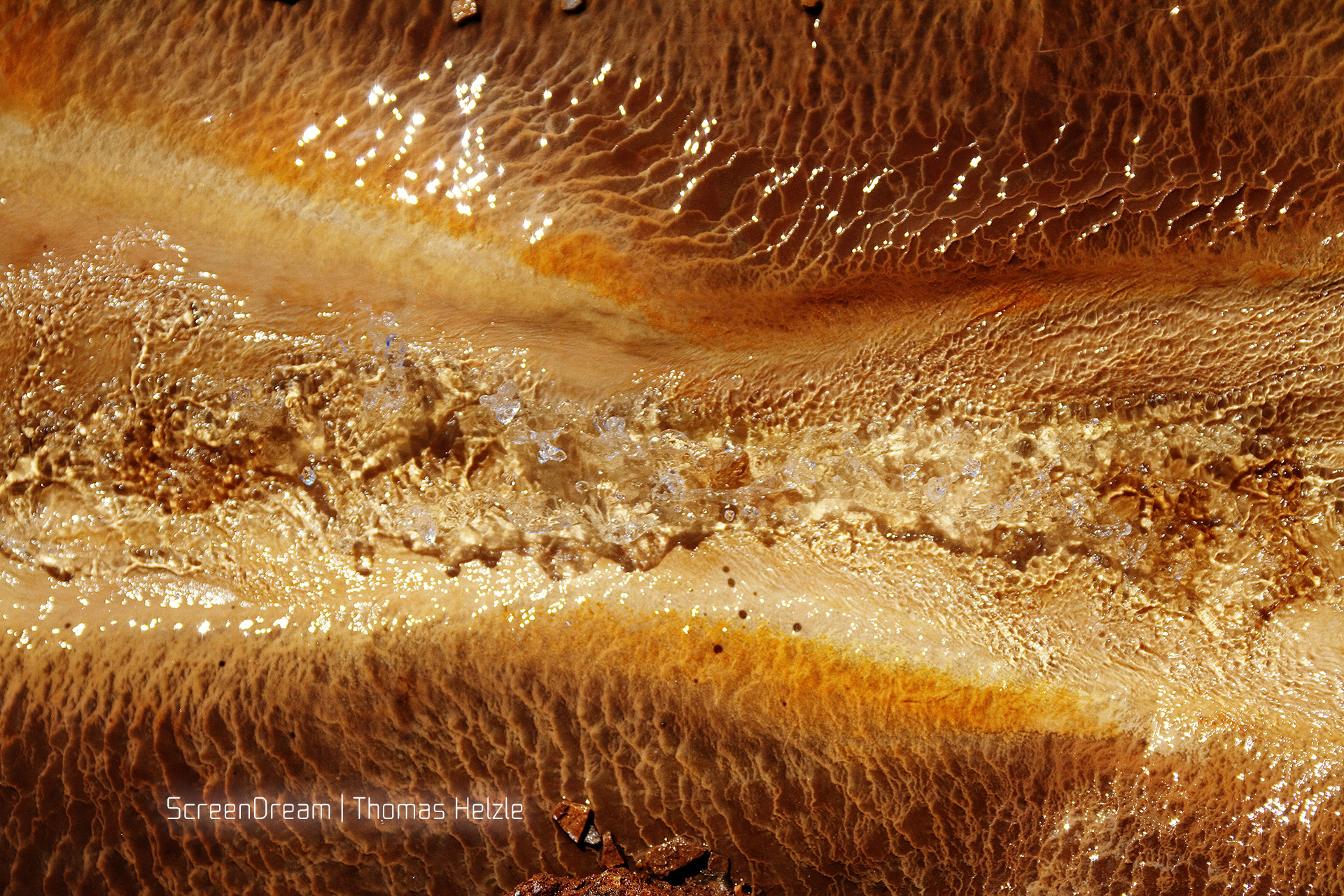 In the outflow of the Geysir in Iceland the minerals create beautiful patterns.